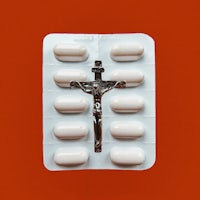 a package of pills with a crucifix on it